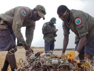 Rangers check and record a ghost net. Photo © Crocodile Islands Rangers