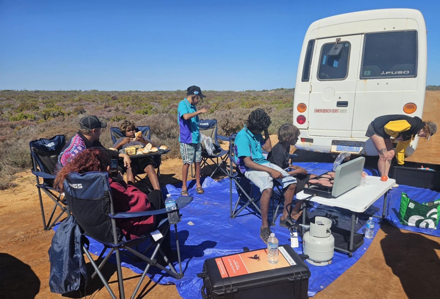Participants of the Burrowing Bees Bush Classrooms enjoying a cooked barbecue lunch