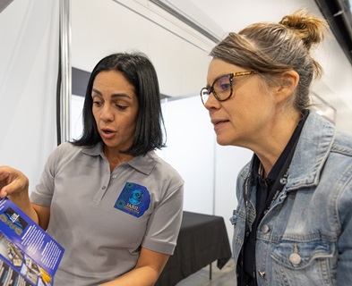 Stall holders speaking with attendees at the Supply Nation's Connect Forum in Sydney, New South Wales.