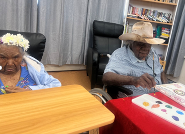 A woman and a man creating art