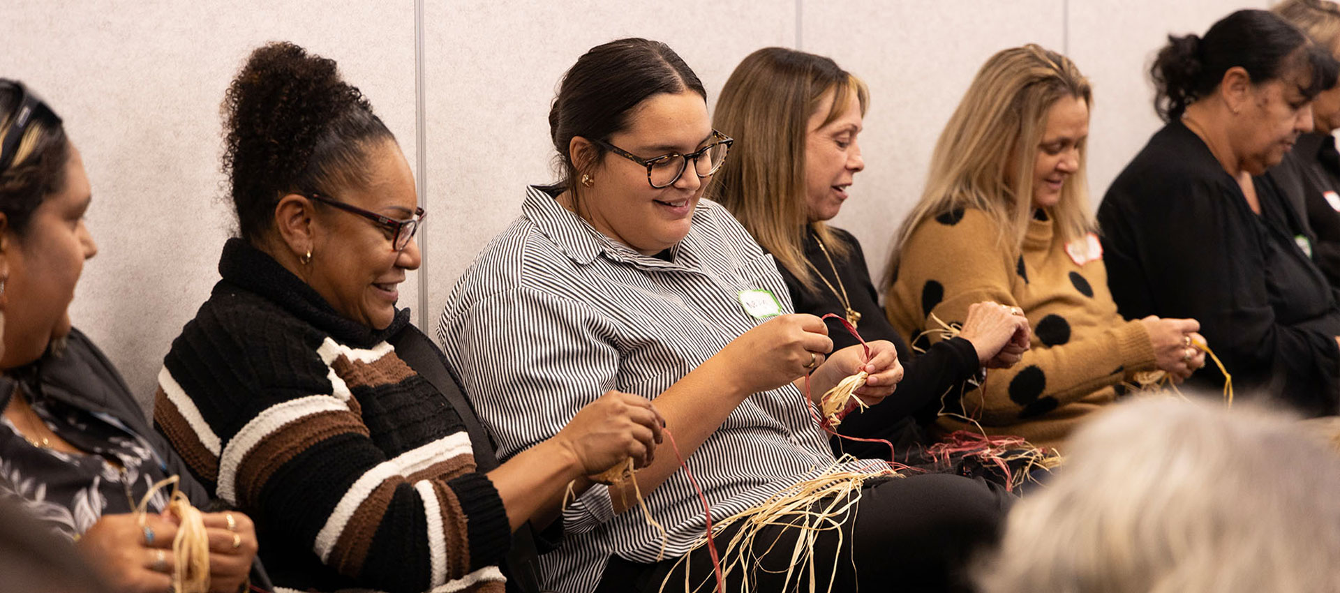 Image: NIAA staff basketweaving at the Aboriginal and Torres Strait Islander forum, Canberra, Australian Capital Territory