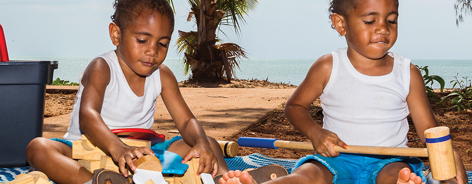 Anthony and Pryce Williams on the beachfront at Seisia. The boys go to the Red Dust Playgroup in Bamaga run by the Northern Peninsula Area Family and Community Services Aboriginal & Torres Strait Islander Corporation.