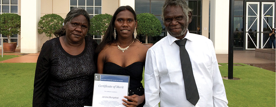 Jericka Mungatopi proudly showing off her award with parents Katrina and Fredrick.