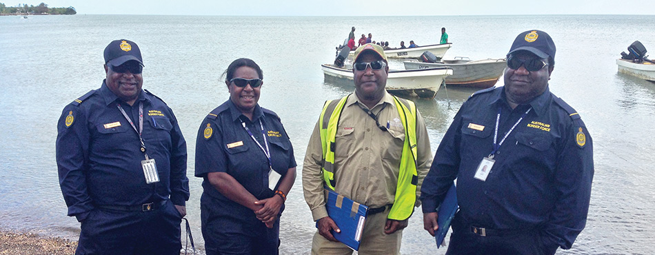 This photograph shows border monitoring officers working on Saibai Island.