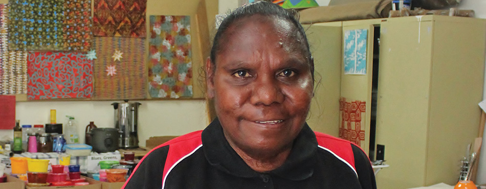 Pictured in this photograph is Denise Sampi who has learnt new skills through a Vocational Training and Employment Centre programme and now works with East Kimberly’s Job Pathways.