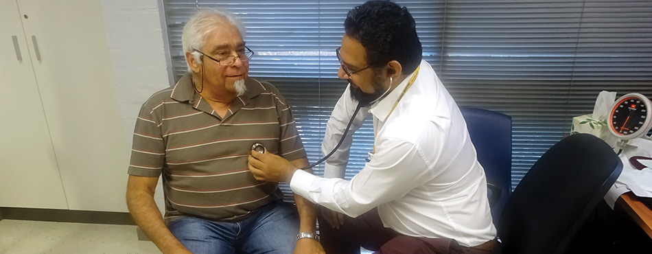 Pictured here is a patient being treated by his doctor at theWinnunga Nimmityjah (Strong Health) Aboriginal Health Service in the ACT. 