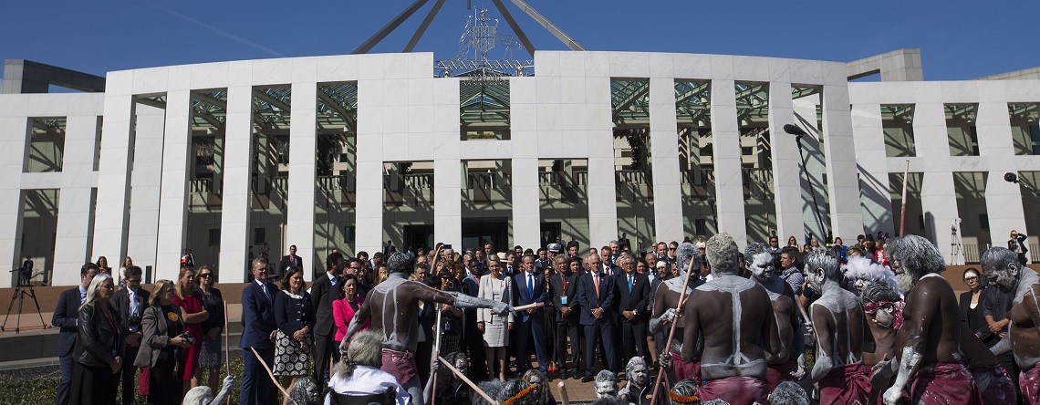 Gathering of people in front of Parliament House, Canberra - polititians, community members and Indigenous people dressed in traditional attiire