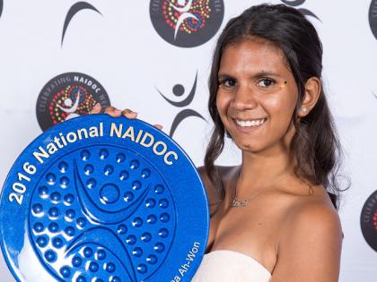 Female Indigenous youth holding her 2016 National NAIDOC Award