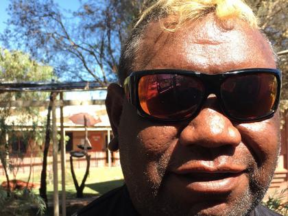 Photograph of Indigenous man Lance McDonald with sunglasses on, smiling at the camera