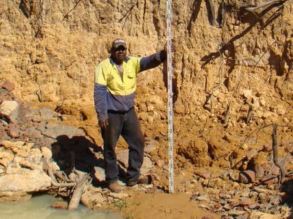 In this photo Daniel Jones is shown in a river bed. Daniel is the Bradshaw and Timber Creek Contracting and Resource Company Managing Director and says he is proud to provide a positive example to young Aboriginal people in his community. 