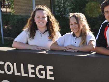 The photo shows Macey Shipp, Yamirra Talbot and Marty Jeffery in front of the Dubbo College Senior Campus. All three students graduated year 12.