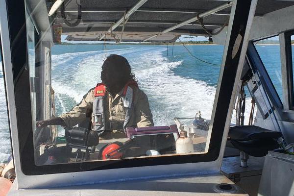 Caption: Christine Tchemjiri, Ngantawudi woman, safely skippers the Thamarrurr Ranger vessel in Hyland Bay during training with AIMS.