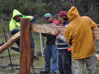 Rangers building a fence. Photo © Banbai Business Enterprises Inc