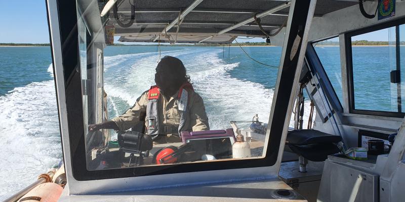 Caption: Christine Tchemjiri, Ngantawudi woman, safely skippers the Thamarrurr Ranger vessel in Hyland Bay during training with AIMS.