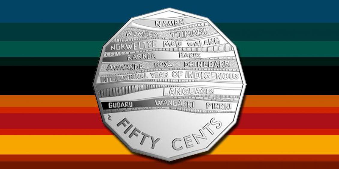 Image shows new 50 cent coin against a multi coloured background