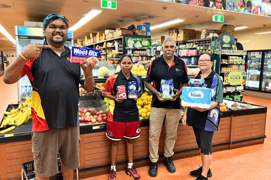 People hold items in a supermarket