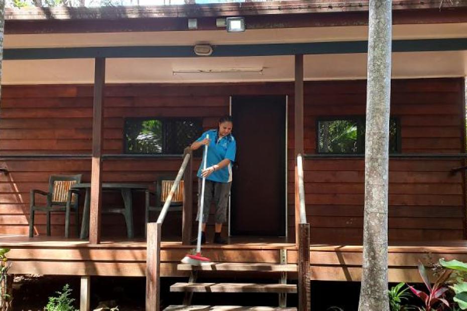 Flossie Sam sweeping steps at the front door of Cape York Peninsula Lodge